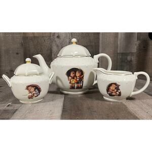 M. J. Hummel Porcelain  Stormy Weather Tea Set by The Danbury Mint